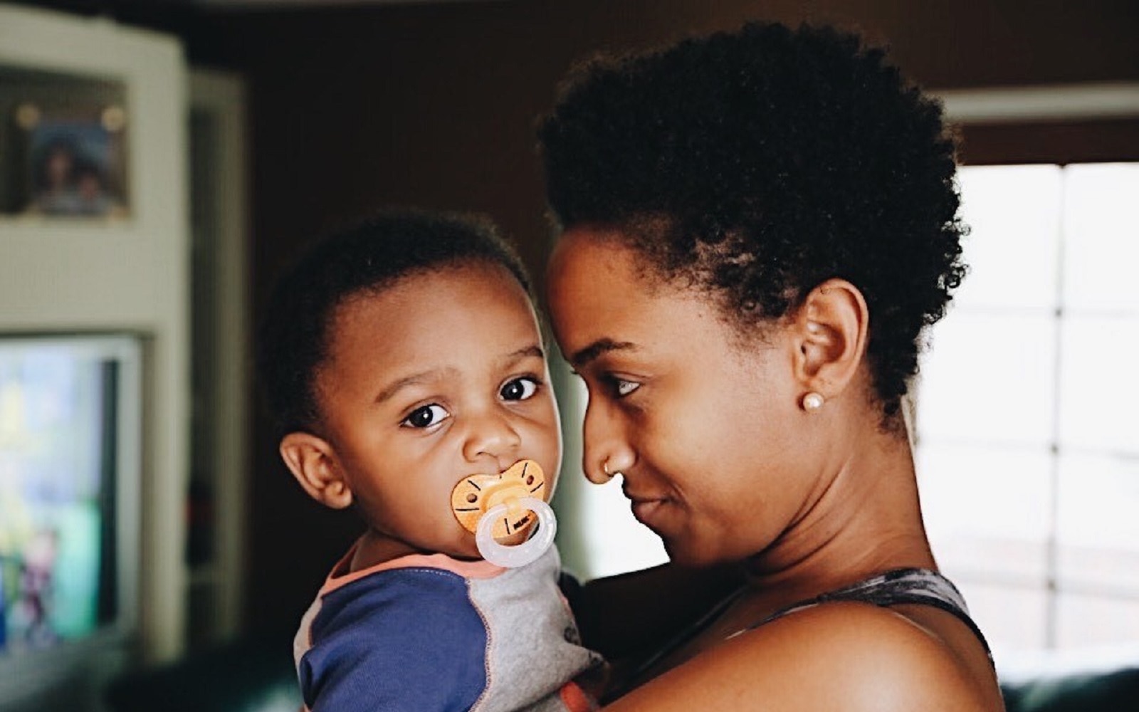 Mother holding her infant son.