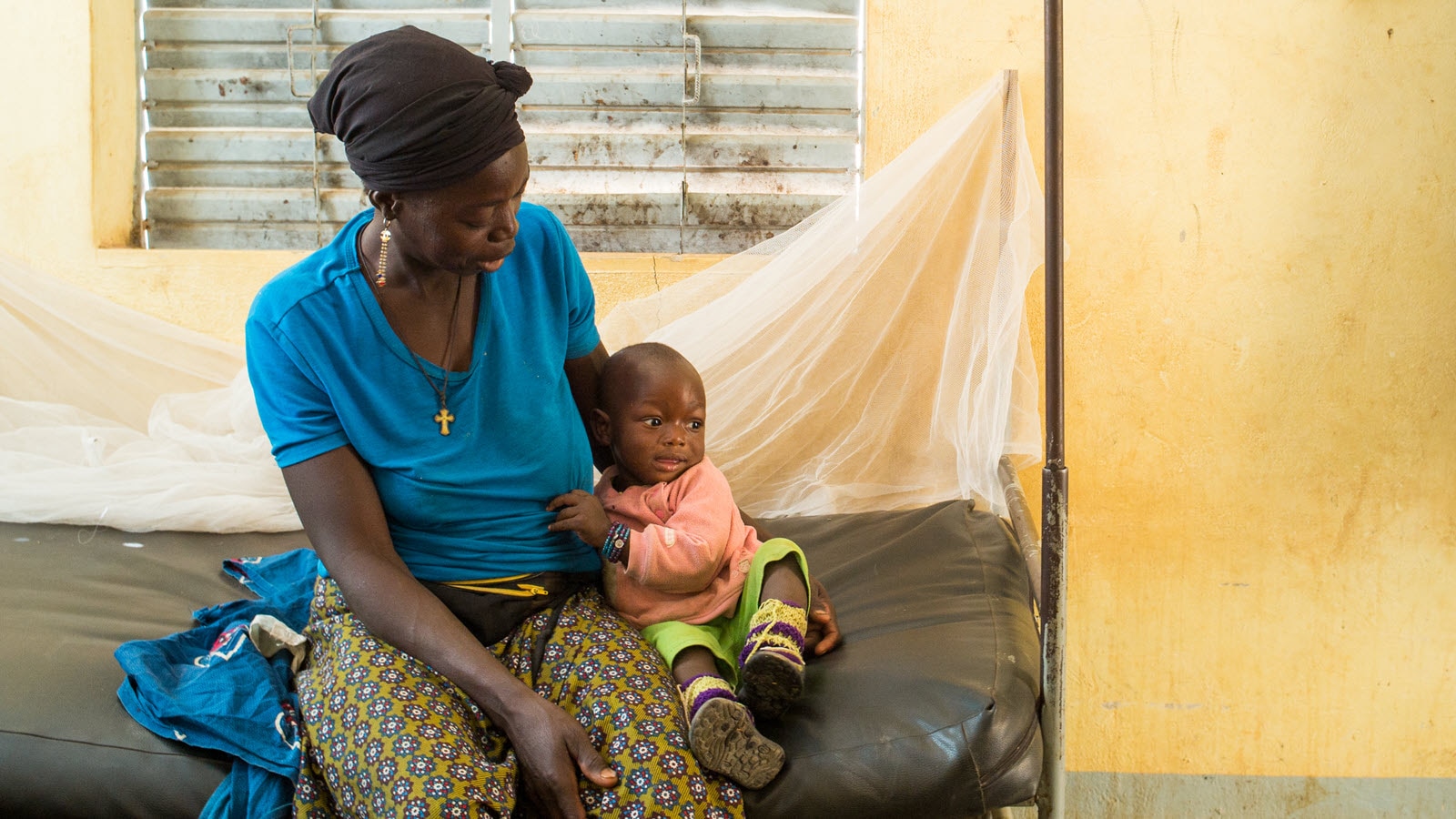 A woman waits for prenatal services and family planning counseling at a health center in Ramongo in the rural area of Koudougou, Burkina Faso on January 22, 2018.